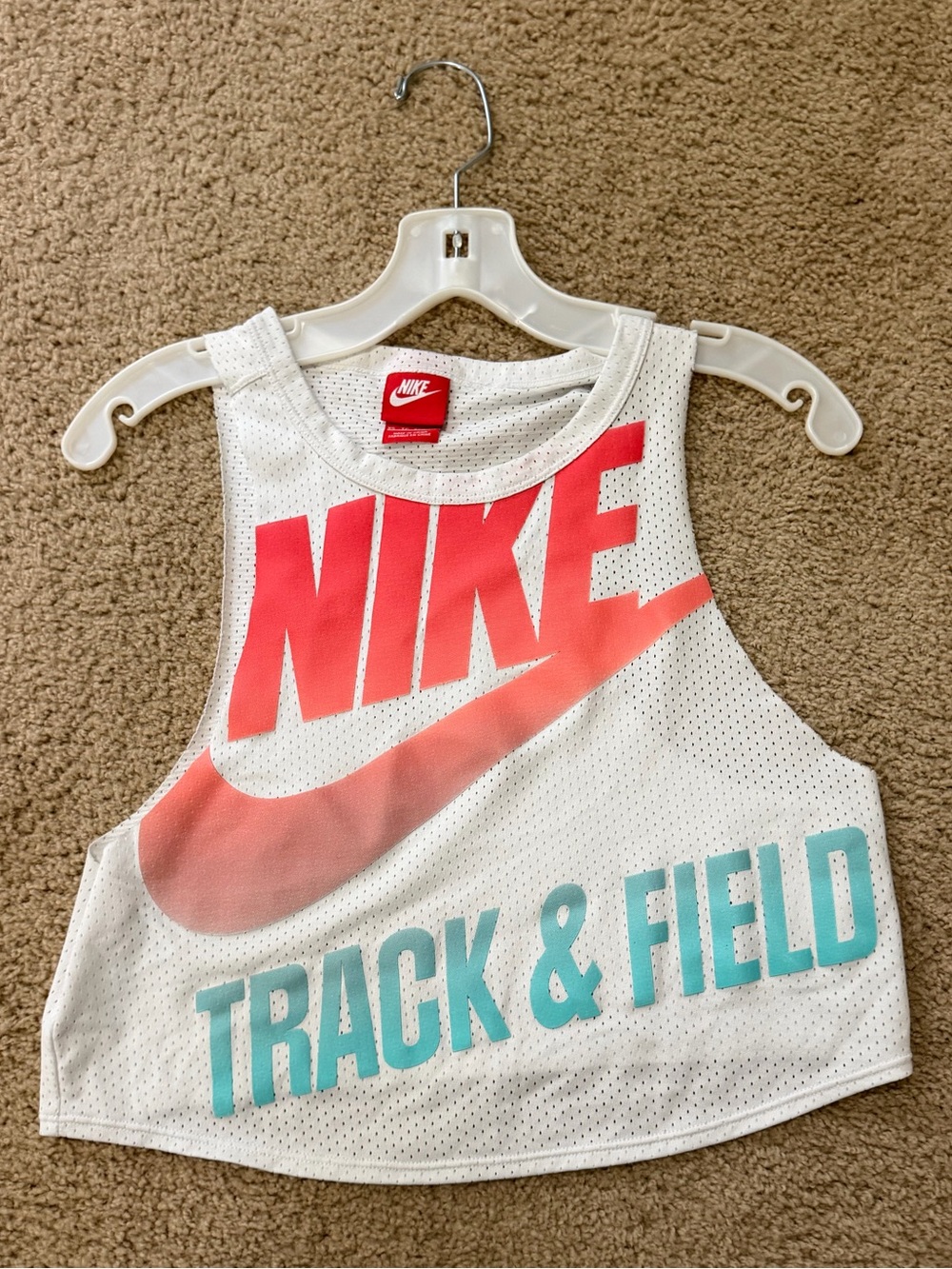 Nike White Tank Top with Pink Logo and Teal Track & Field Text